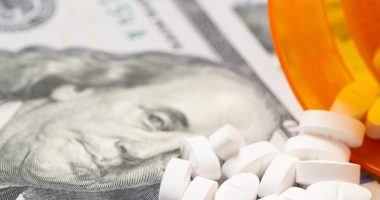 Pills on a hundred dollar bill