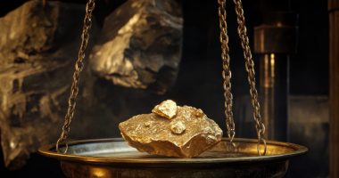 Piece of gold being weighed