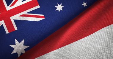 Indonesian and Australian flags fighting or kissing who knows