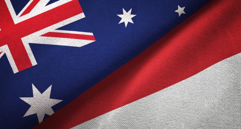 Indonesian and Australian flags fighting or kissing who knows