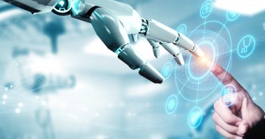 Robot hand reaching out to a person