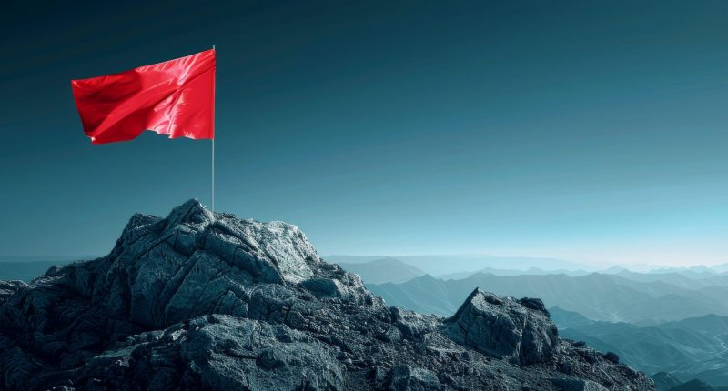 Red flag on a mountain peak