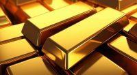 Stack of gold bars close up background, shiny gold ingot